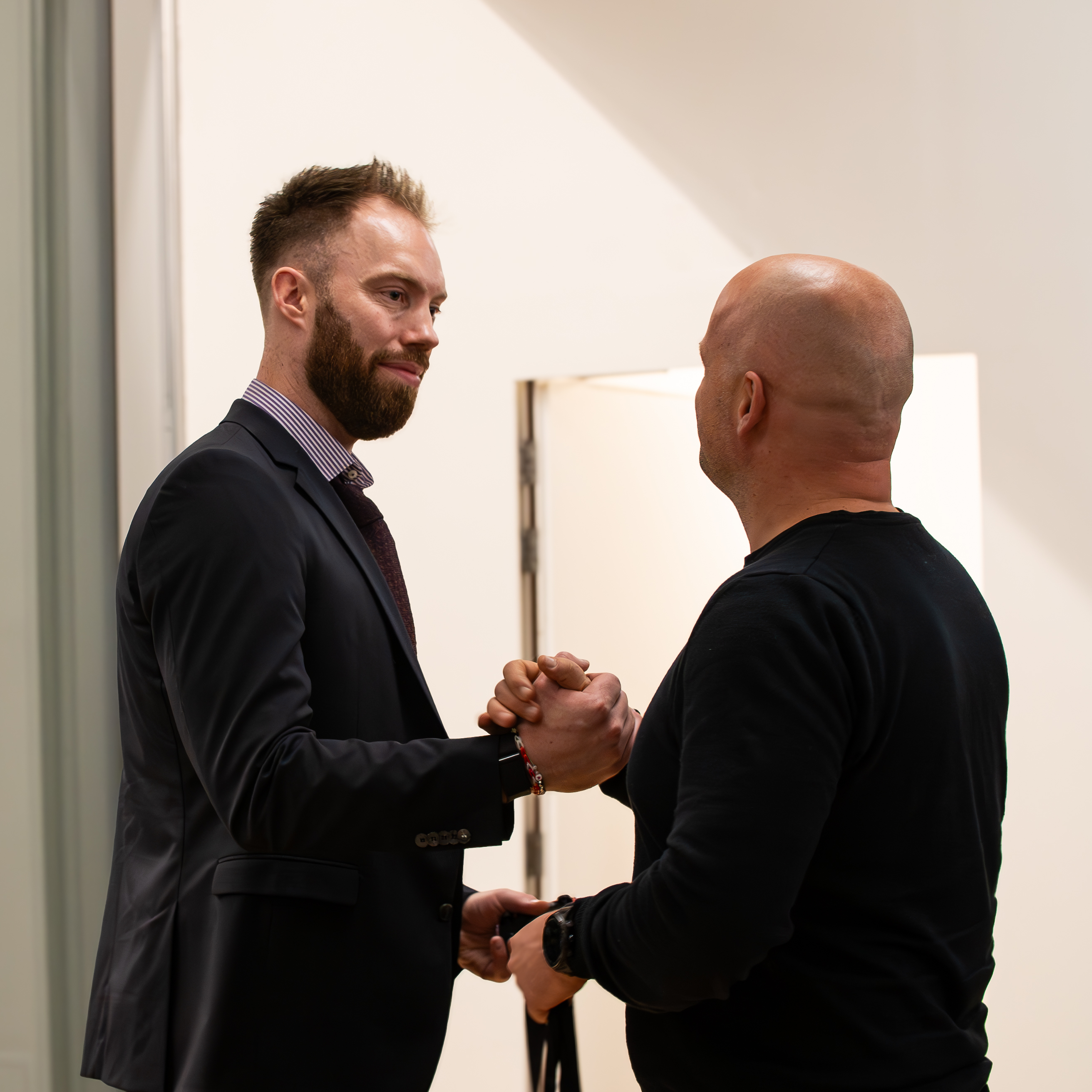 Professional networking moment between attendees